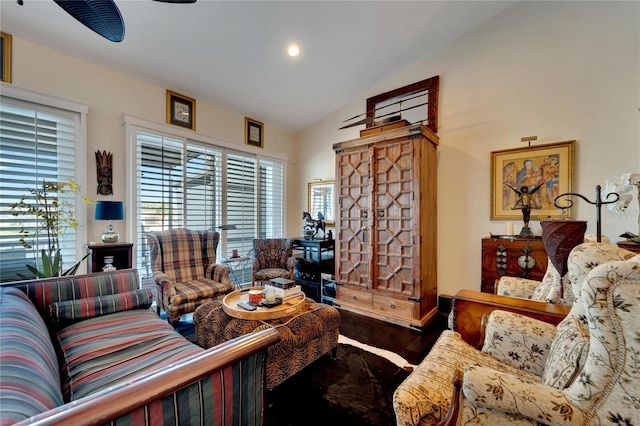 living room with hardwood / wood-style flooring and vaulted ceiling