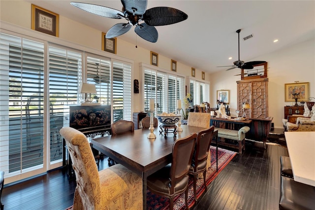 dining space with ceiling fan, a wealth of natural light, and dark hardwood / wood-style floors