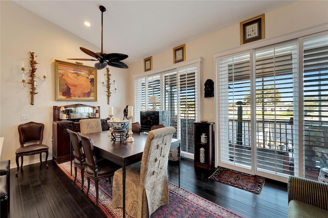 dining room featuring vaulted ceiling, dark hardwood / wood-style floors, and ceiling fan