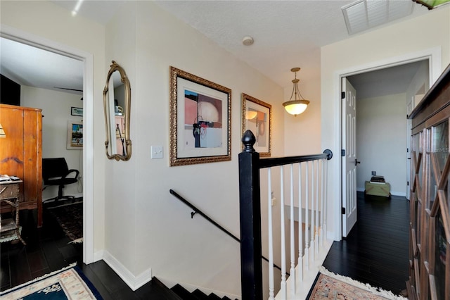 stairway with hardwood / wood-style flooring