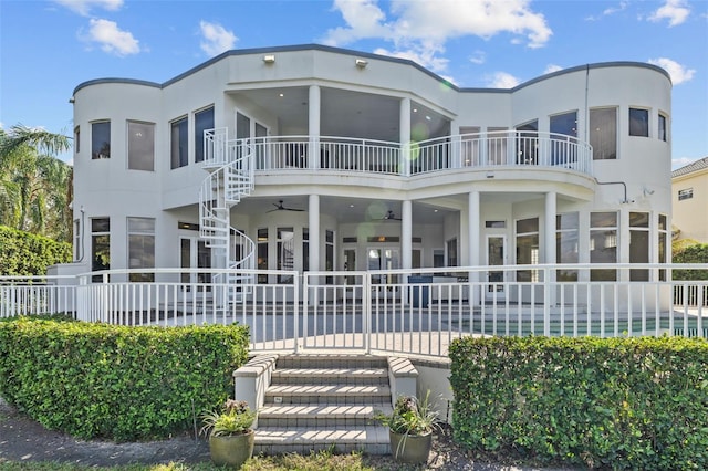 rear view of house with ceiling fan