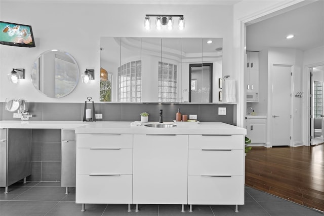 bathroom with vanity and tile patterned flooring