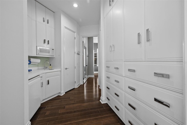 hallway with sink and dark hardwood / wood-style floors