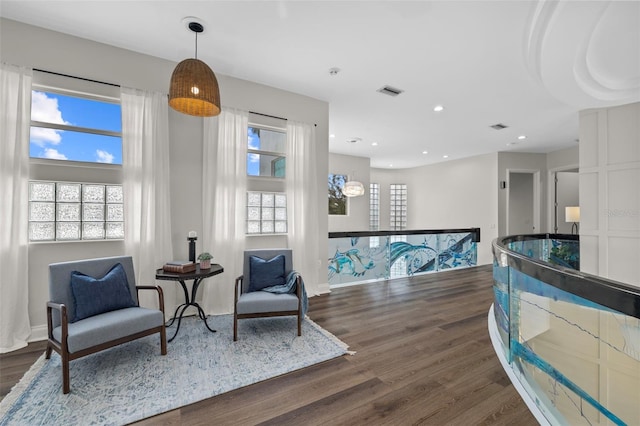 living area with dark hardwood / wood-style floors