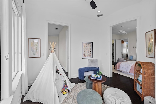 bedroom featuring dark wood-type flooring and ceiling fan