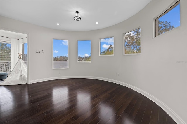 unfurnished room featuring hardwood / wood-style floors