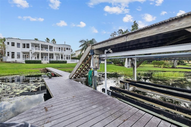 2905 Safe Harbor Dr, Tampa, FL 33618 - dock with a water view, a lawn, and stairway