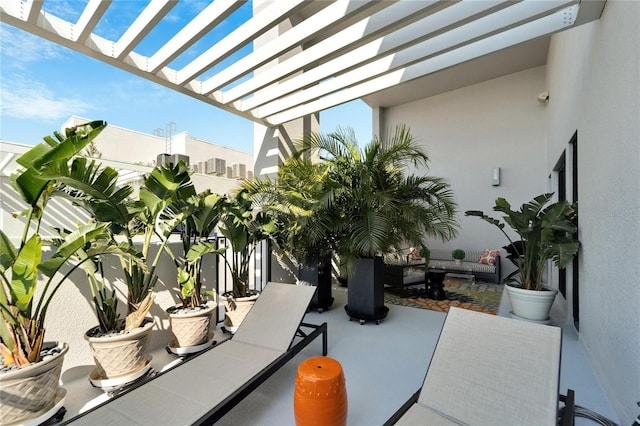 view of patio with a pergola and outdoor lounge area