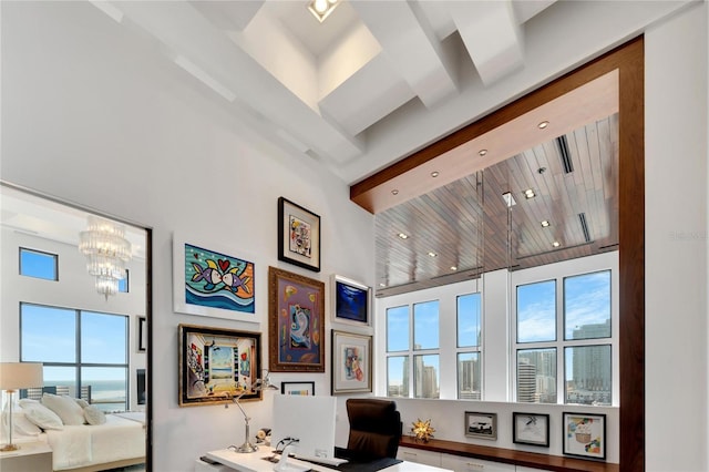 office space featuring wood ceiling, a high ceiling, and an inviting chandelier