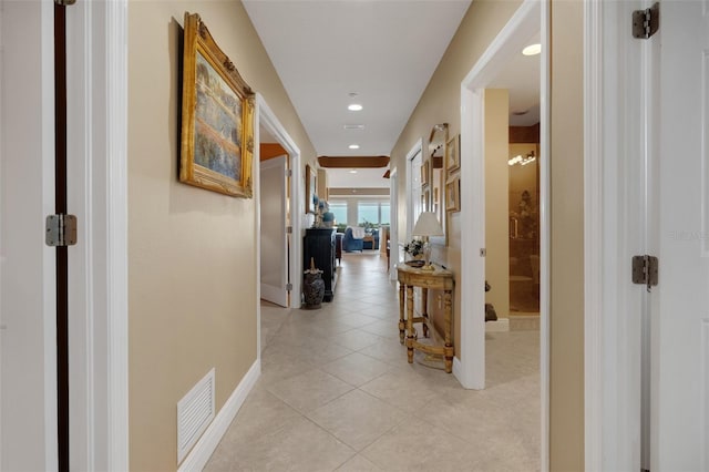 corridor featuring light tile patterned floors