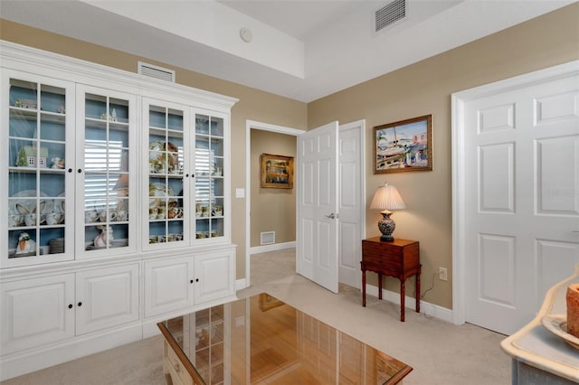 entryway featuring light carpet