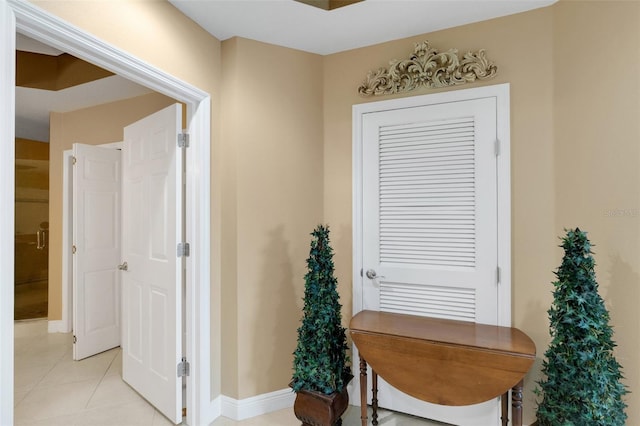 hallway with light tile patterned floors