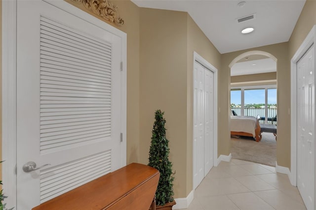 hallway with light tile patterned floors