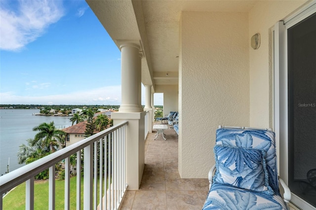 balcony featuring a water view