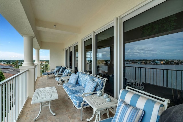 balcony featuring a water view