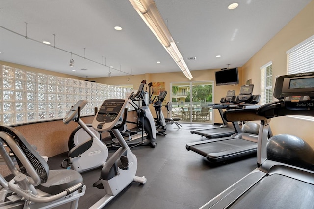 exercise room with visible vents and recessed lighting