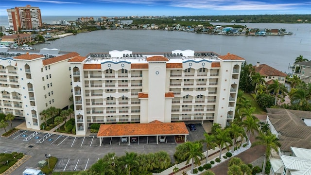 birds eye view of property with a water view