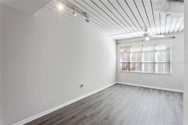 spare room with hardwood / wood-style flooring