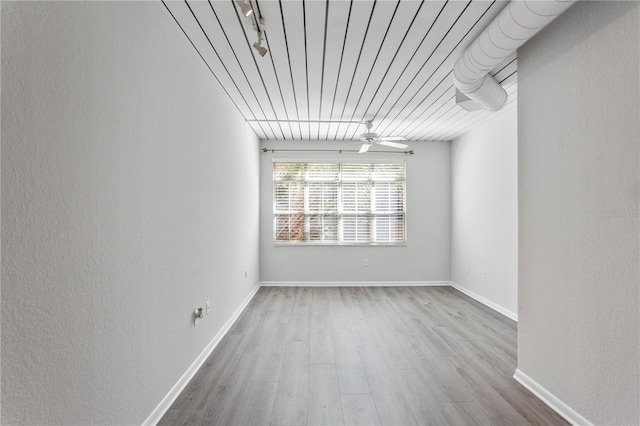 spare room featuring ceiling fan and hardwood / wood-style floors