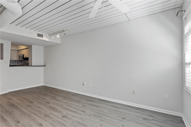 spare room featuring light hardwood / wood-style floors and ceiling fan