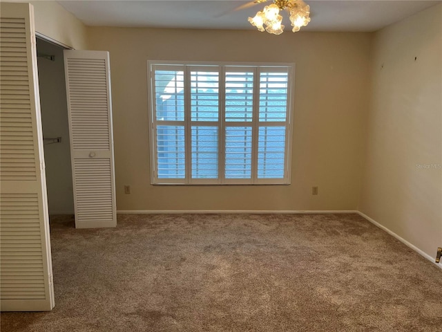 spare room featuring carpet floors