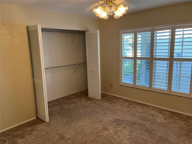 unfurnished bedroom featuring a closet and carpet