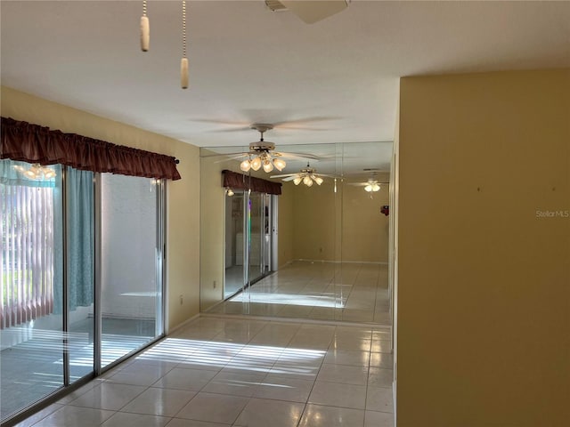 unfurnished room featuring light tile patterned flooring