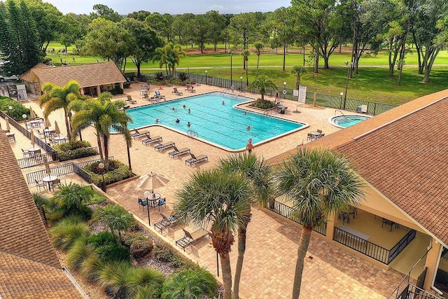 view of swimming pool featuring a patio area