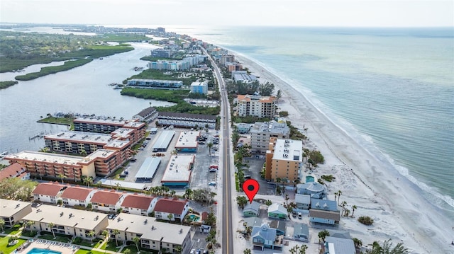 aerial view featuring a view of the beach and a water view