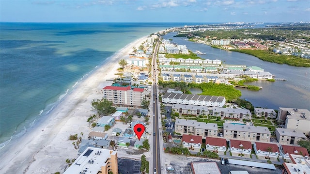 drone / aerial view featuring a water view and a view of the beach