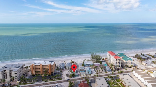 bird's eye view featuring a water view and a beach view