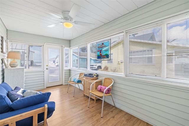 sunroom / solarium with ceiling fan and wood ceiling