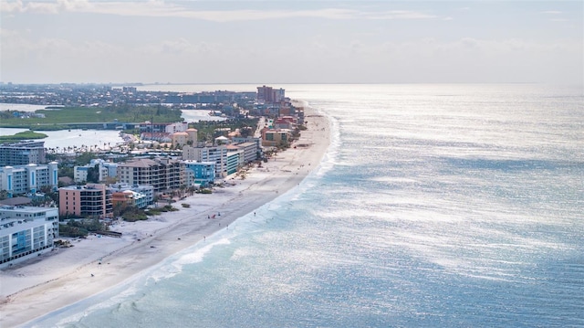 drone / aerial view with a water view and a beach view