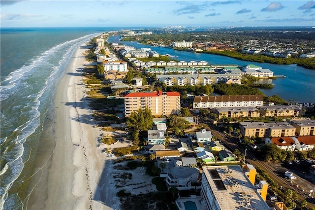 aerial view with a water view and a view of the beach