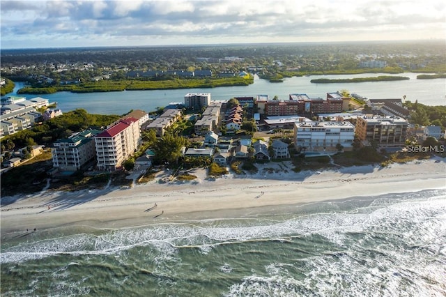 drone / aerial view with a water view and a view of the beach