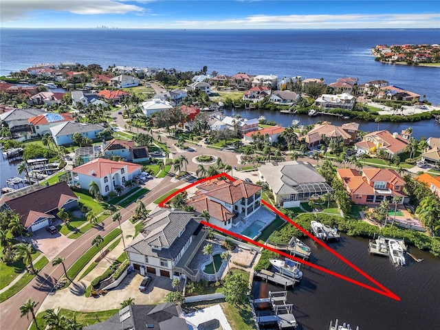 birds eye view of property featuring a water view