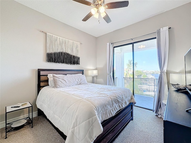 carpeted bedroom featuring ceiling fan and access to exterior