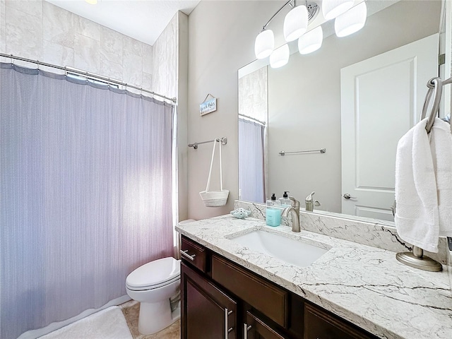 bathroom with vanity, a shower with curtain, and toilet