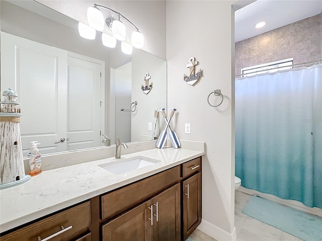 bathroom with vanity, a shower with shower curtain, toilet, and tile patterned floors