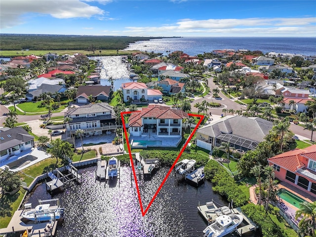 birds eye view of property featuring a water view