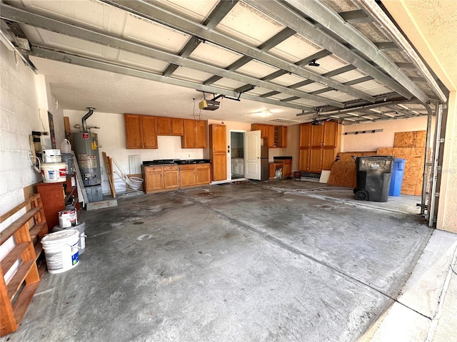 garage featuring a garage door opener, water heater, and white refrigerator