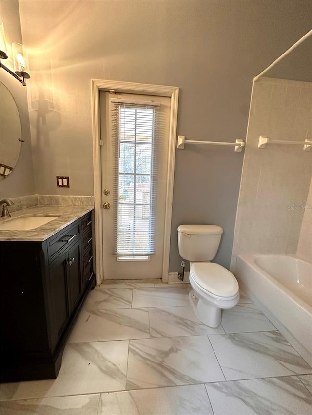 full bathroom featuring toilet, vanity, and bathing tub / shower combination