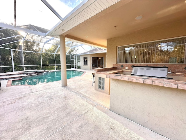 view of pool featuring an in ground hot tub, area for grilling, a patio area, and glass enclosure