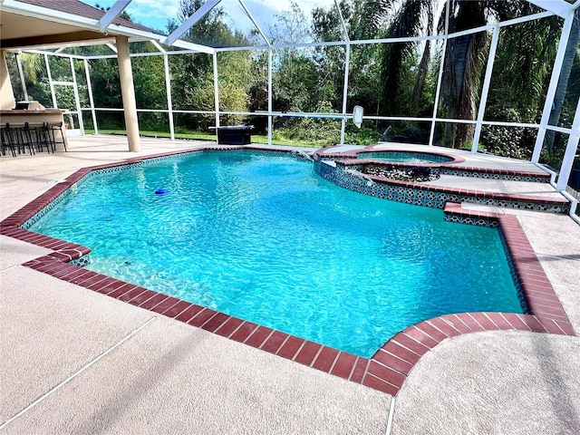 view of swimming pool with an in ground hot tub, a patio area, and glass enclosure