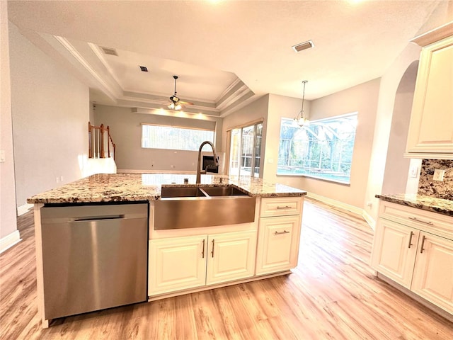 10411 Riverburn Dr, Tampa, FL 33647 - kitchen with dishwasher, a sink, light wood-type flooring, a tray ceiling, and light stone countertops