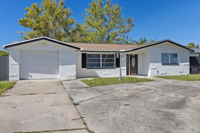 single story home with a garage