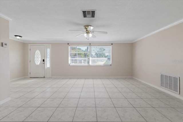 foyer featuring crown molding, light tile patterned floors, and ceiling fan