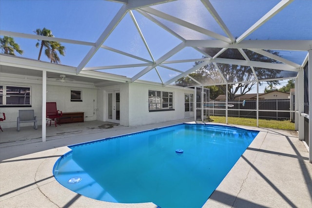 view of pool with a patio area, french doors, a lanai, and ceiling fan