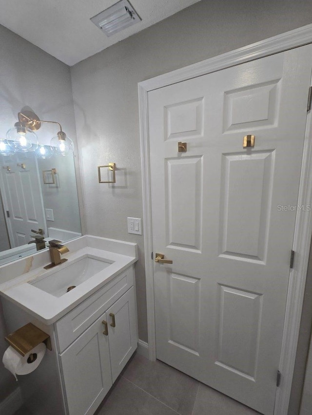 bathroom featuring vanity and tile patterned flooring