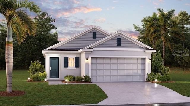 view of front of house with a lawn and a garage